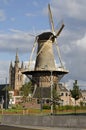 Delft windmill and church