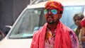 Delhi, India - August 21,2020 : Indian People face smeared with colors participate in Ganesh Visarjan