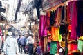 Beautiful handicraft scarves and shawls hanging on a street side shop for sale