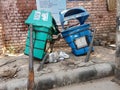 Delhi, India - 21 February 2021 - Broken and damaged trash bin made of plastic box and placed on steel pillars representing Clean