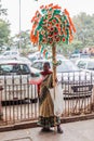 DELHI, INDIA - JANUARY 24, 2017: Street seller of Indian flags and patriotic items at Connaught Place in Delhi. Next day, January