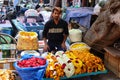 A man selling flowers on a local Indian market