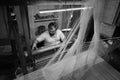 Man works as weaver in the carpet workshop