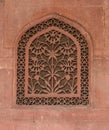 DELHI, INDIA - MARCH 15, 2019: a decorative floral air vent on a wall at red fort