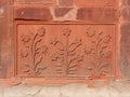 DELHI, INDIA - MARCH 15, 2019: a decorative floral carving on a stone wall at red fort