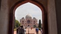 DELHI, INDIA - MARCH 12, 2019: humayun`s tomb framed by entrance arch in delhi Royalty Free Stock Photo