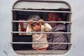 Little child looking from train window at New Delhi train station