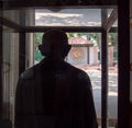 DELHI, INDIA - MARCH 15, 2019: statue mahatma gandi facing the window of the house he walked through on the day he was