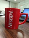 Delhi, India - March 20th 2020:A closeup shot of Coffee Cup from Nescafe on table Royalty Free Stock Photo