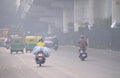 Vehicles moving in the road amidst heavy smog in Delhi..
