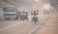 Vehicles moving in the road amidst heavy smog in Delhi..