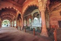 Red Fort Delhi medieval red sandstone hallway with marble throne of the emperor at Delhi, India