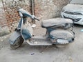 Delhi, India - 21 February 2021 : An old Bajaj scooter on the street of India