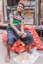 DELHI, INDIA - OCTOBER 22, 2016: Young potato peeler in the center of Delhi, Ind