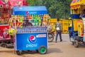Delhi, India - September 16, 2017: Colorful carts sell drinks and ice creams clustered in the streets in Delhi, India