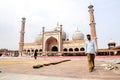 Delhi, India, september 3, 2010: Muslim men walking on in front of mosque Masjid in Delhi, India