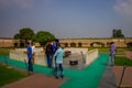 DELHI, INDIA - SEPTEMBER 25 2017:Unidentified people near of the beautiful grave in Rajghat, New Delhi as memorial at Royalty Free Stock Photo