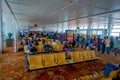 DELHI, INDIA - SEPTEMBER 19, 2017: Unidentified people sitting in a chair inside of Delhi airport waiting for the flight Royalty Free Stock Photo