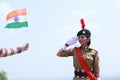 Delhi,India - 21St January 2019: Lady Army Cadet Saluting In Front Of Indian Flag With Pride outdoor In Daytime, Celebrating