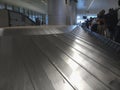 Empty airport luggage belt in motion