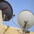 Delhi, 5 July 2020, India: Satellite dish and antenna of Dish TV, Tata sky, Videocon DTH and other DTH Providers on the roof of a