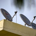 Delhi, 5 July 2020, India: Satellite dish and antenna of Dish TV, Tata sky, Videocon DTH and other DTH Providers on the roof of a