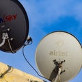 Delhi, 5 July 2020, India: Satellite dish and antenna of Dish TV, Tata sky, Videocon DTH and other DTH Providers on the roof of a