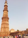 Delhi`s famous Qutub Minar and hundreds of tourists