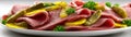 Deli meat appetizer featuring corned beef slices and pickles on a plate Royalty Free Stock Photo