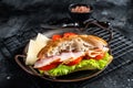 Deli meat sandwich with turkey ham, cheese, tomato and Lettuce. Black background. Top view Royalty Free Stock Photo