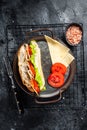 Deli meat sandwich with turkey ham, cheese, tomato and Lettuce. Black background. Top view Royalty Free Stock Photo