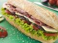 Deli Sub Sandwich on a Chopping Board Royalty Free Stock Photo