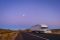 Deliberately blurred 18 wheel long haul truck on highway in desert