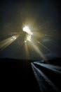 Deliberately Dark Lonely Road with light rays Royalty Free Stock Photo