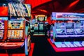 Deliberately defocused wide angle blur of unidentifiable slot machines in casino gaming floor Royalty Free Stock Photo