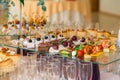 Delicacies and snacks at the Banquet. The buffet celebration. Restaurant catering. Table setting at the reception Royalty Free Stock Photo