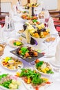 Delicacies, snacks and fruit on the festive table in the restaurant. Celebration. Catering. Banquet table Royalty Free Stock Photo