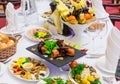 Delicacies, snacks and fruit on the festive table in the restaurant. Celebration. Catering. Banquet table Royalty Free Stock Photo