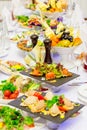 Delicacies, snacks and fruit on the festive table in the restaurant. Celebration. Catering. Banquet table Royalty Free Stock Photo