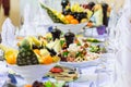 Delicacies, snacks and fruit on the festive table in the restaurant. Celebration. Catering. Banquet table Royalty Free Stock Photo