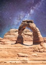 Delicate Arch as seen from lower point of view with milky way at night, Arches National Park, UT