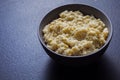 Delicate artichoke spread in bowl on grey background