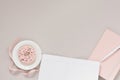 A delicate and beautiful banner : a pink donut on a white plate and a pink diary with a white pen, an open notebook with clean Royalty Free Stock Photo