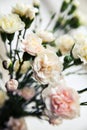 Delicate bouquet of carnations in a vase vintage. romance