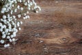 Delicate bouquet of flowers and a wooden abstract background