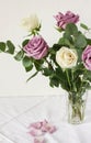 Delicate bouquet of light purple and white roses and eucaliptus