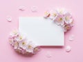 Delicate cherry blossoms surrounding a blank note on a soft pink background Royalty Free Stock Photo