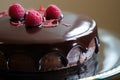 delicate chocolate cake, filled with raspberry cream, topped with dark chocolate ganache