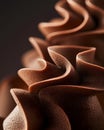 Delicate chocolate curls are arranged beautifully, showcasing their intricate texture and shape.