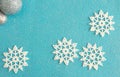 delicate christmas composition, snowflakes on blue felt background, copy space